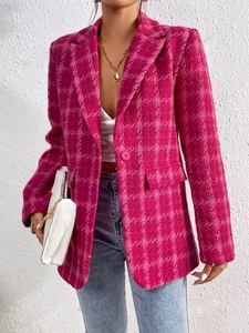 Detail of rose pink tweed texture and single button on a stylish longline blazer jacket