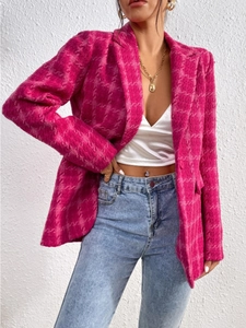 Detail of rose pink textured plaid blazer featuring woven fabric and single-breasted design