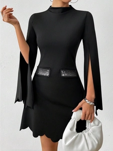 Detail of black long sleeve dress with rhinestone pockets and scalloped hem design