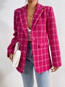 Detail of pink plaid tweed blazer with single button and textured flap pockets