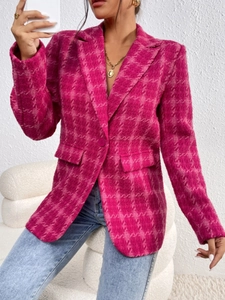 Close-up of fuchsia tweed texture and single button on women's plaid blazer jacket