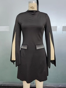 Detail of black dress featuring split sleeves and rhinestone pocket embellishments