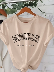 Women's beige short sleeve T-shirt with Brooklyn New York print and stylish knotted hem