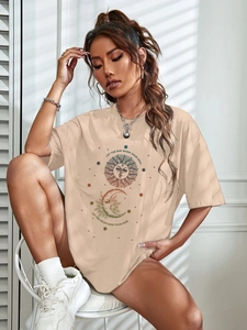 Detail of sun and moon graphic print on a beige loose-fit cotton casual short sleeve t-shirt