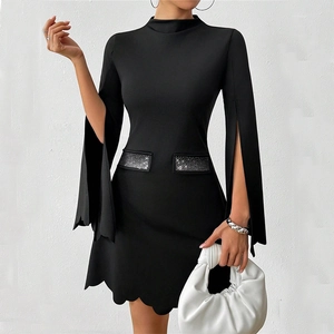 Elegant black long sleeve dress with split sleeves, rhinestone accents and scalloped hem