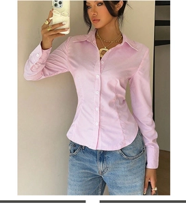 Detail of pink and white striped long sleeve shirt with slim fit and button closure