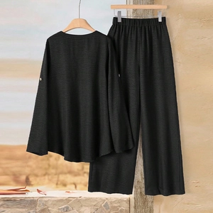 Elegant black two-piece set featuring long sleeve round neck top and wide leg trousers