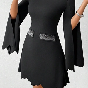 Slim fit black dress with scalloped hem, flared sleeves and rhinestone waist details