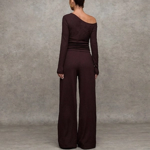 Women's burgundy ribbed knit set featuring one-shoulder long sleeve top and wide-leg pants
