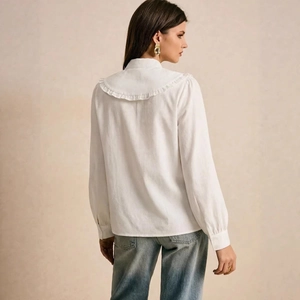 Elegant white long sleeve shirt with a ruffle Peter Pan collar and cotton texture fabric