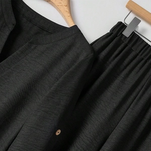 Women's black cotton linen two-piece set featuring V-neck long sleeve top and elastic waist pants