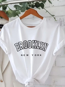 White cotton t-shirt featuring Brooklyn print and a stylish knotted hem design
