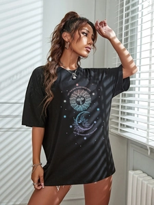 Detail of bohemian sun and moon print on black cotton oversize casual t-shirt