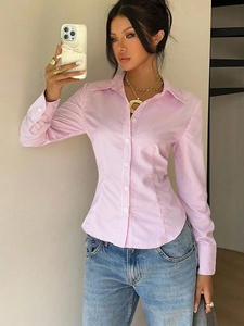 Mirror selfie showing vertical pink and white striped long sleeve shirt with slim fit waist