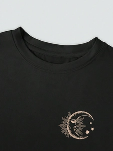 Detail of reinforced crew neck and golden moon print on black cotton t-shirt