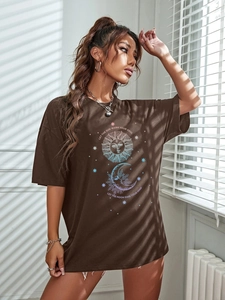Detail of sun and moon astrology print on oversized brown cotton blend T-shirt