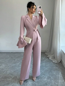 Elegant solid pink wide-leg jumpsuit for women with flare sleeves and lapel collar design
