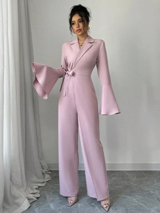 Elegant dusty pink wide-leg jumpsuit with bell sleeves and waisted tie for women