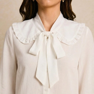 Elegant white Peter Pan collar shirt with ruffle trim and pussy-bow tie for women