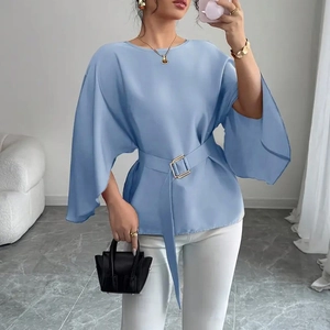 Elegant light blue satin blouse featuring flared sleeves and a gold buckle waist belt