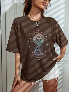 Detail of sun and moon graphic print on oversized dark brown cotton t-shirt for women