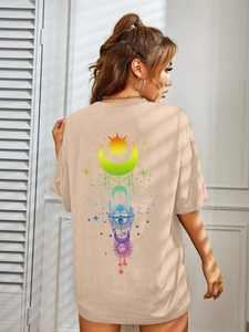 Detail of khaki oversized t-shirt back with colorful celestial sun and moon print