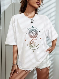 Detail of white oversized T-shirt with sun and moon print and bohemian spiritual quotes