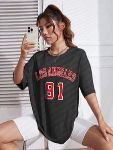 Detail of oversized black t-shirt featuring Los Angeles 91 retro graphic and cotton fabric