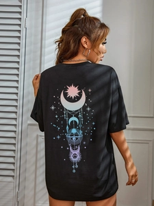 Detailed back view of oversized black T-shirt featuring a gradient celestial art print