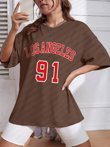 Detail of Los Angeles 91 print on brown oversized short sleeve cotton t-shirt