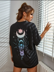 Oversized black cotton tee featuring a celestial moon and sun graphic on the back