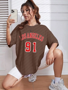 Detail view of brown loose fit T-shirt with Los Angeles 91 vintage print on the front