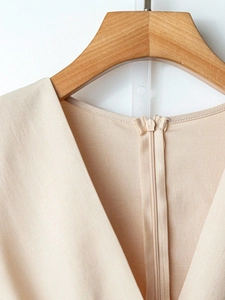 Elegant beige V-neck jumpsuit with lace splicing and concealed back zipper detail