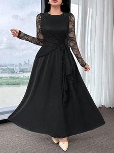 Detail of elegant black lace sleeves and high waist pleats on long-sleeve A-line dress