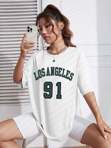 Close-up of white oversized tee with Los Angeles 91 print and ribbed crew neck detail
