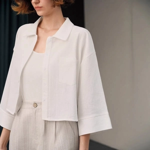 Women's white cotton cropped long-sleeve shirt with lapel collar and chest pocket