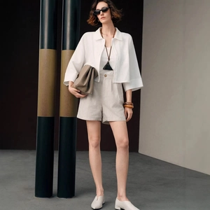 Elegant white short cotton cardigan and high-waist striped shorts set for women