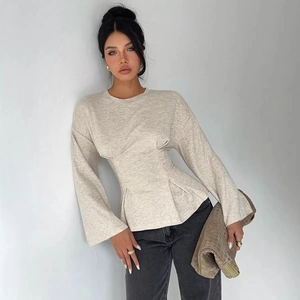 Minimalist beige flare sleeve tunic top with cinched waist and pleated peplum hem