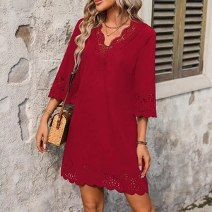 Women's V-neck dark red dress featuring hollow embroidery and lace trim on a sunny day