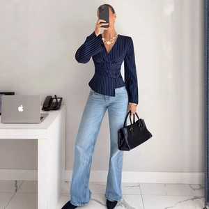 Women's V-neck striped long sleeve shirt with waist pleats and light blue denim jeans