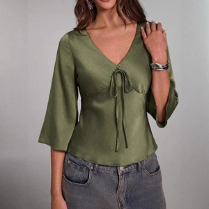 Olive green V-neck satin blouse with lace-up front and flared 3/4 sleeves for women