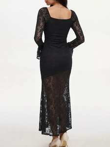 Detail of elegant black floral lace fabric and long flare sleeves on a slim-fit dress