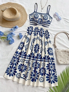 Floral backless summer dress with side cut-outs and flat lay vacation accessories