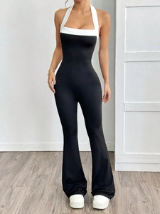 Elegant halter neck jumpsuit for women with black and white color block and flared legs