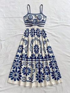 Sexy backless maxi dress with blue floral print and side cutouts for summer vacations