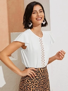 Elegant white chiffon blouse featuring a chic hollow-out lace design and ruffled sleeves