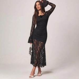 Elegant black lace long sleeve dress featuring floral collar and vintage flared cuffs