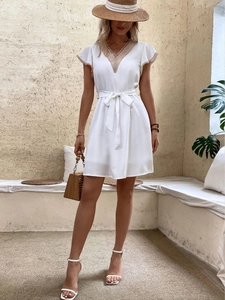 White V-neck dress with lace detailing and short ruffled sleeves for summer wear