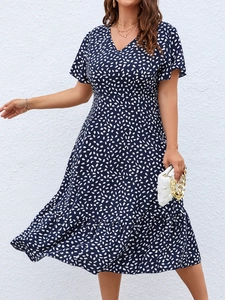 Elegant navy blue V-neck short sleeve dress with white polka dots and ruffle hem