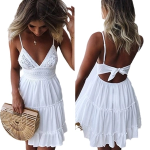 White lace mini summer dress with spaghetti straps and layered cake skirt for beach vacations